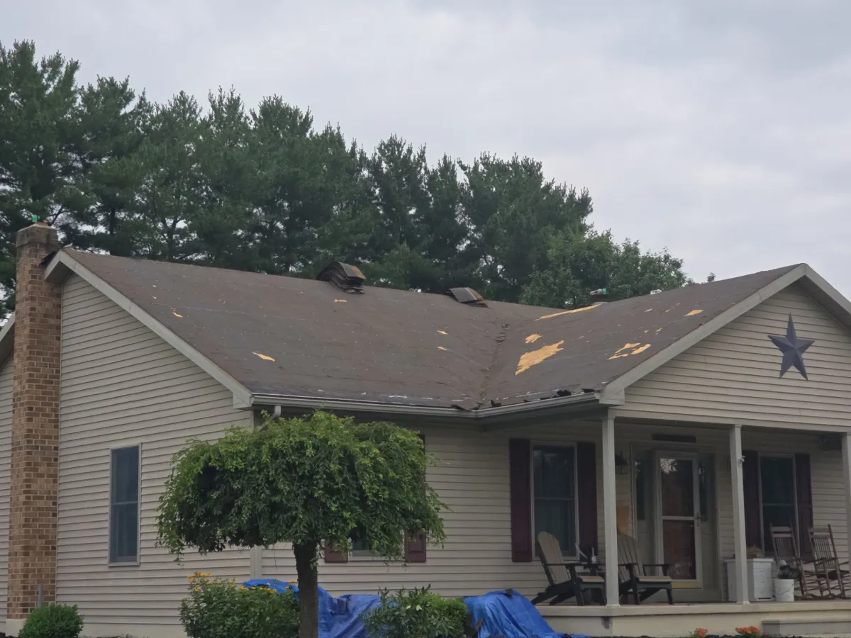 Front porch and worn original roof of a ranch home in Broadfording, Hagerstown, MD