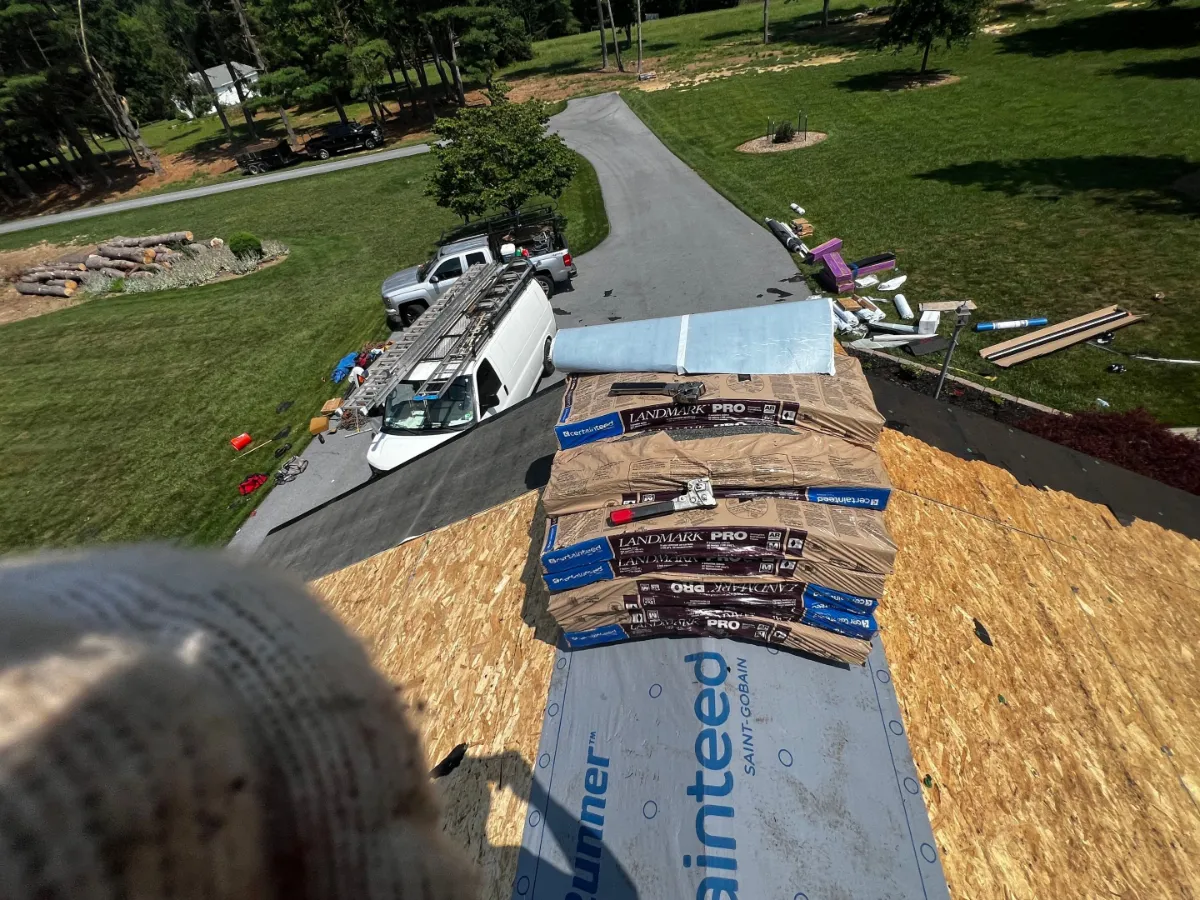Exposed roof decking with new underlayment and shingle bundles staged in Broadfording, Hagerstown, MD