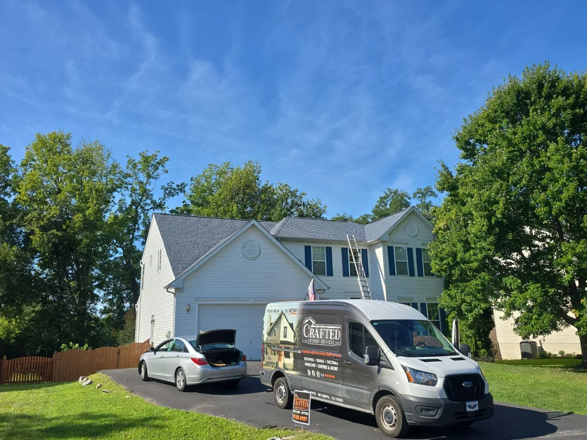 Finished roof and the Crafted Exterior Services van in Charles Town, WV