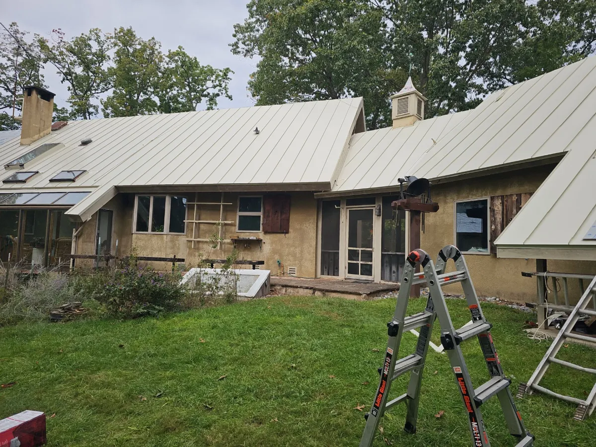 Standing seam metal roof over multiple wings of the home in Falling Waters, WV