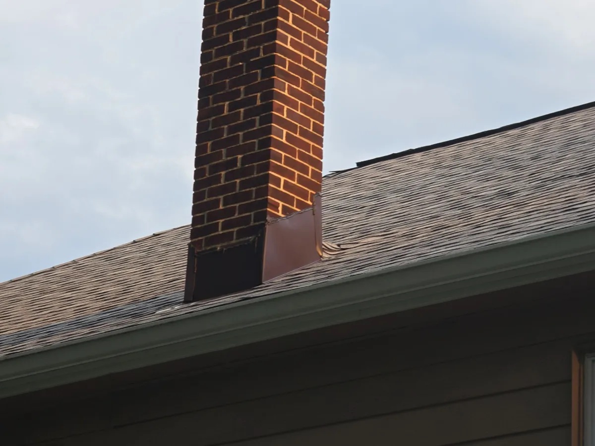 Chimney with new Owens Corning shingles around it in Hagerstown, MD