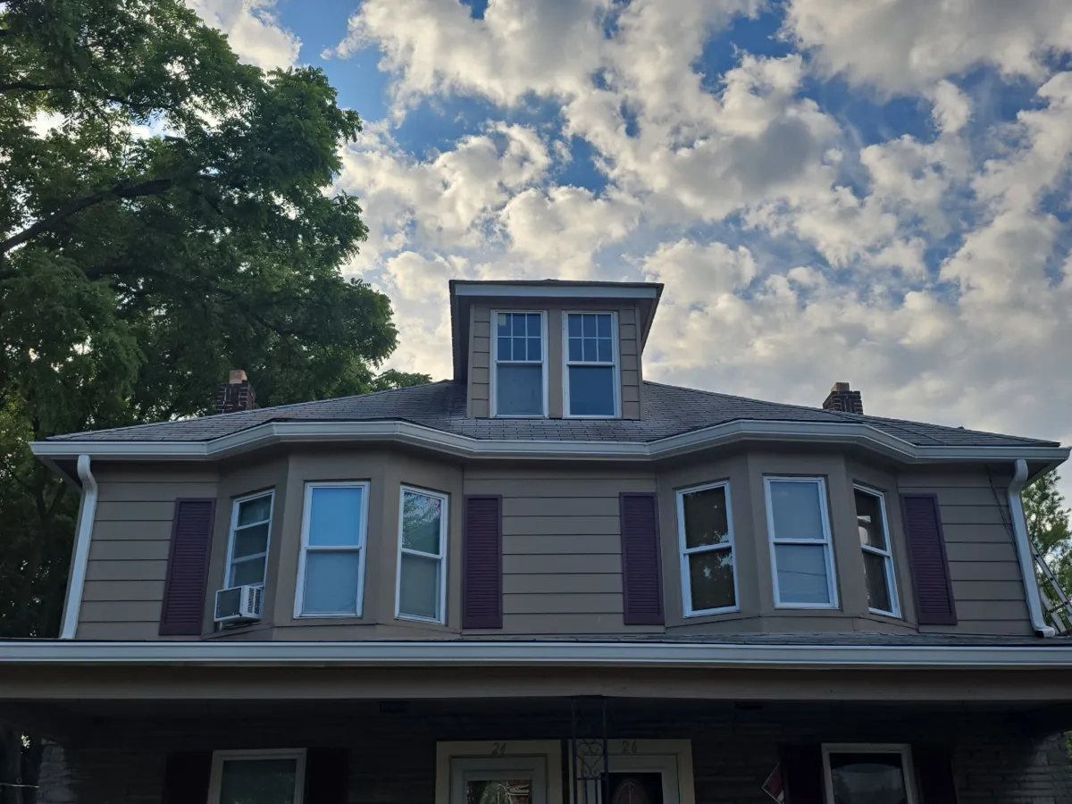 Two-story two-family home with its worn original roof in Hagerstown, MD