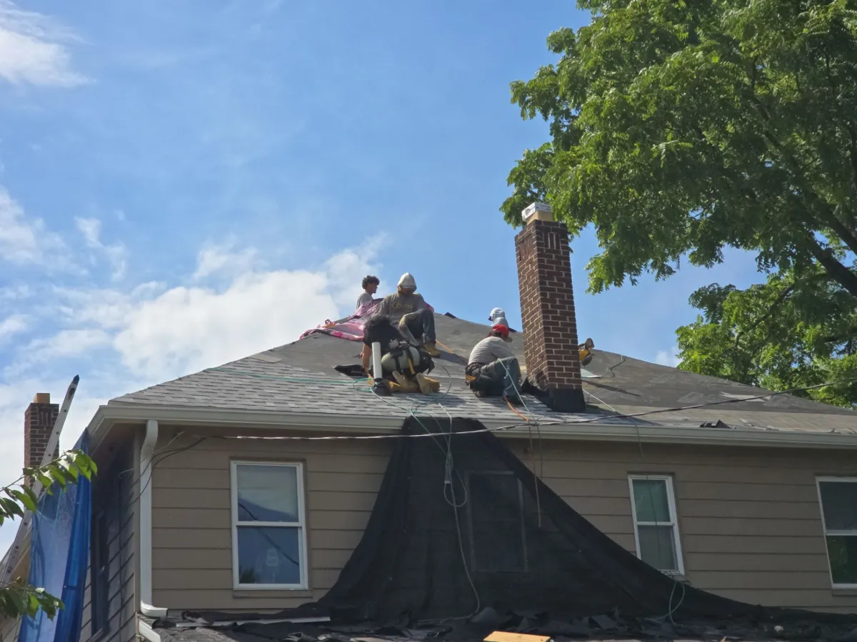 Crew installing the new roof around the chimney in Hagerstown, MD
