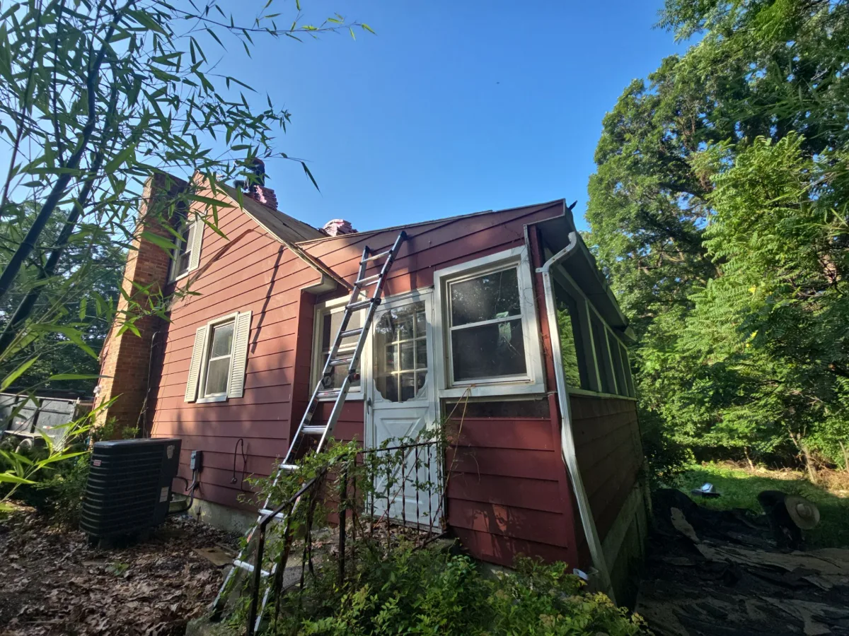 Old red siding on the side of a home in Harpers Ferry, WV