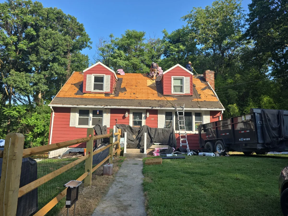 Old roof being removed from a Cape Cod home in Harpers Ferry, WV