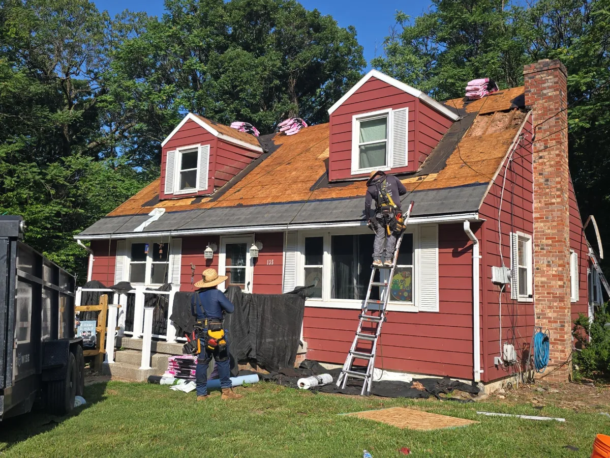 Crew installing a new shingle roof in Harpers Ferry, WV