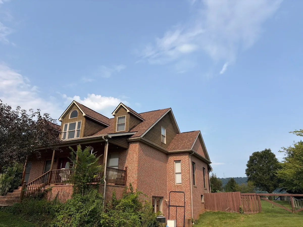 Front of the brick home with the finished roof in Martinsburg, WV