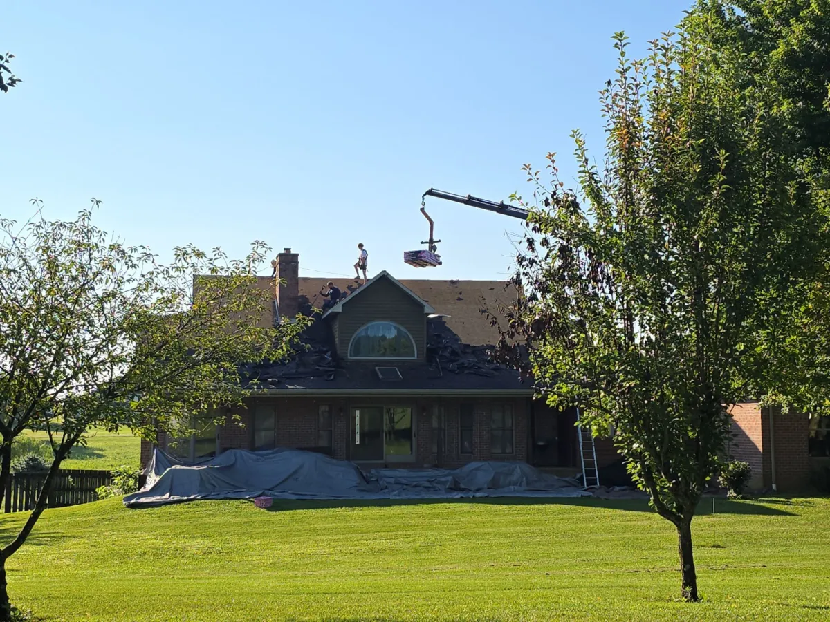 Rear of the brick home at the start of the roof replacement in Martinsburg, WV