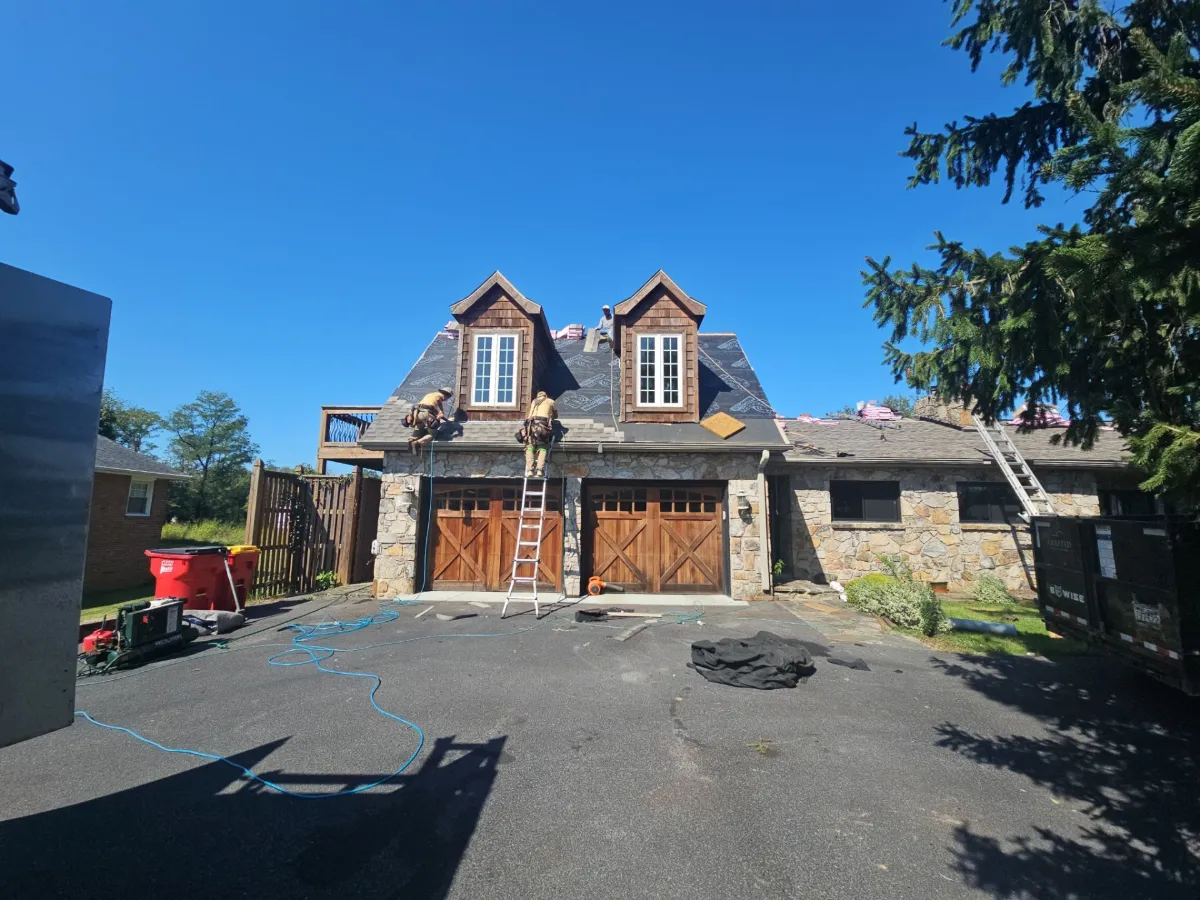 Garage side of the stone ranch with the new roof in Martinsburg, WV