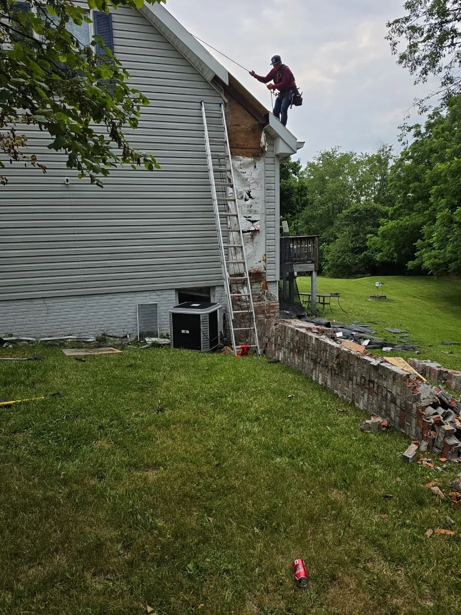 Crew working at the gable end of a Mercersburg, PA home