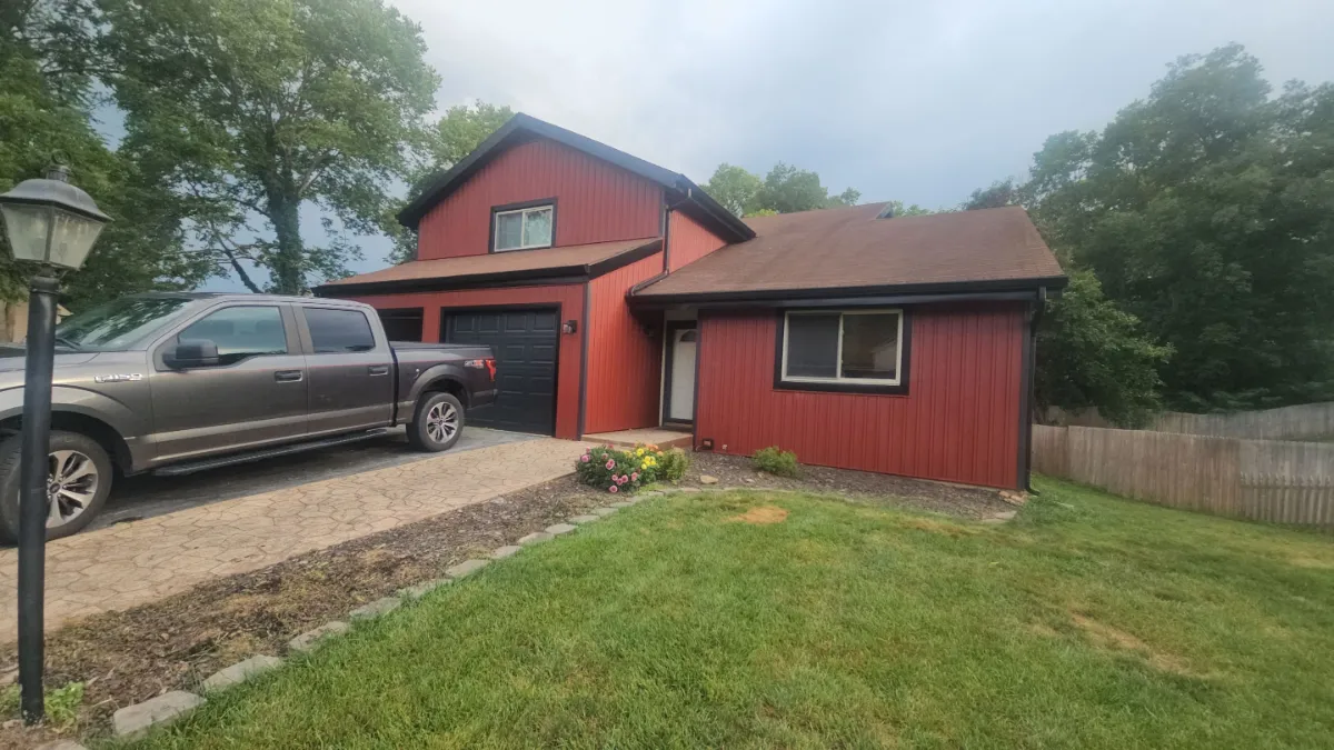 Front and garage with new board and batten siding in Robinwood, Hagerstown, MD