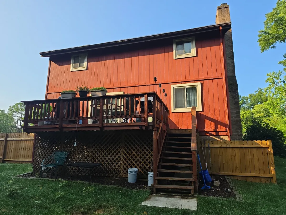 Rear deck and faded original siding before replacement in Robinwood, Hagerstown, MD