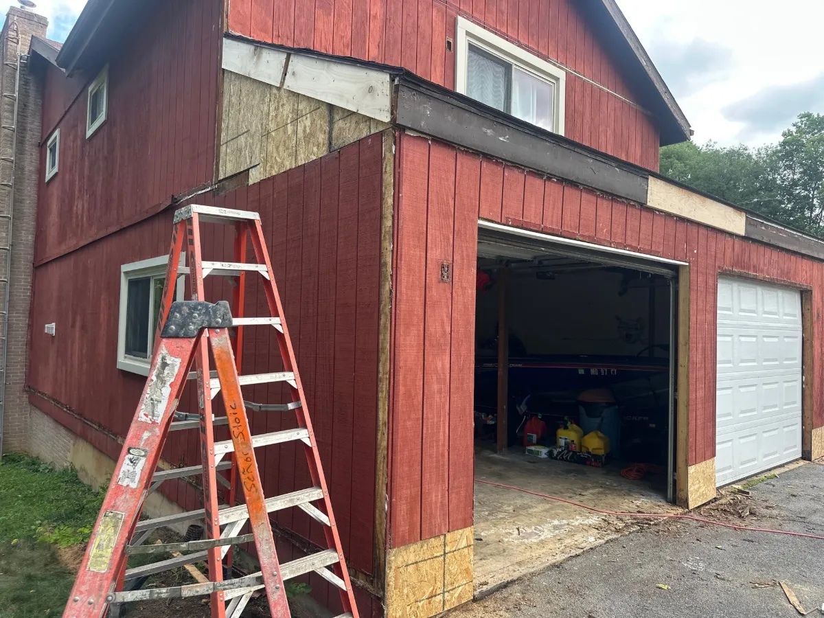 Garage wall with the original siding before replacement in Robinwood, Hagerstown, MD