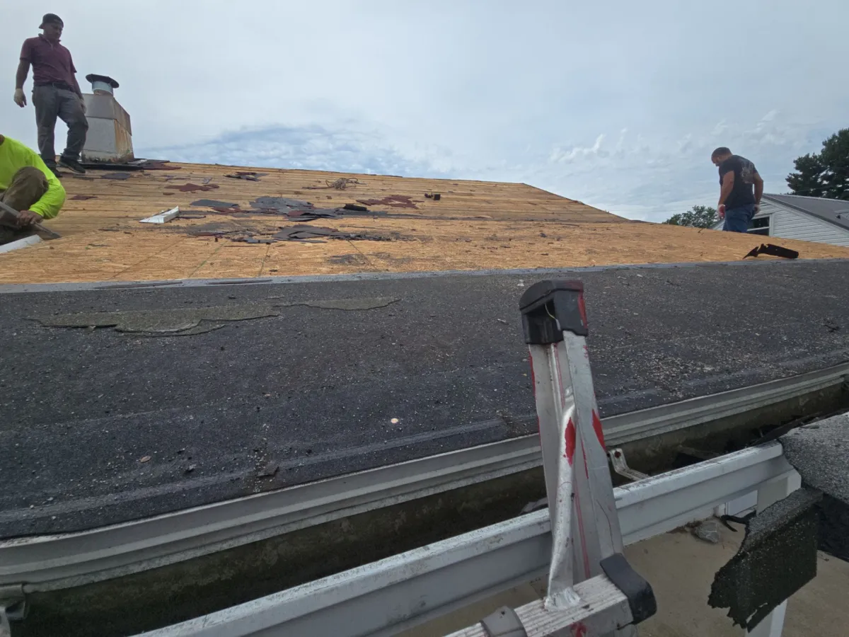 Original shingles at the start of tear-off in Waynesboro, PA